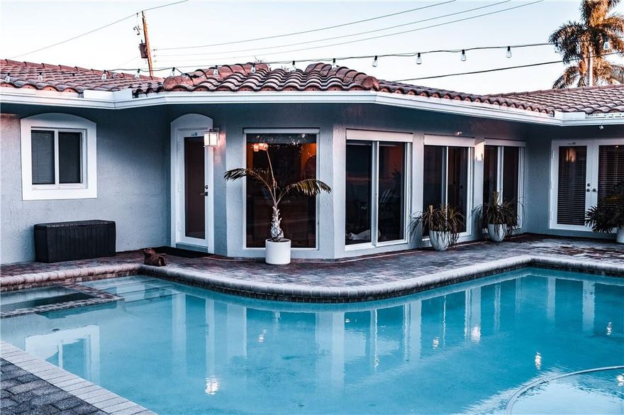 BEAUTFIFUL 3 BEDROOM 4 FULL BATHROOM HOME IN WONDERFUL LIGHTHOUSE POINT, PVC PIPES THROUGHOUT HOME (2021), NEW AC UNIT (2021/SPLIT AC (2021), NEW KITCHEN APPLIANCES (2021), GRANITE KITCHEN COUNTERTOPS, ROOF RESTORED (2021), SALT WATER POOL AND SPA WITH AQUA LINK I LINK CONTROLS, THEATER ROOM WITH 130 INCH PROJECTION SCREEN AND NEW AMPLIFIER (2021), MASTER BATH FULLY UPGRADED, PGT HURRICANE IMPACT WINDOWS THROUGHOUT HOME, FULL CABANA BATHROOM, AND LAUNDRY ROOM.