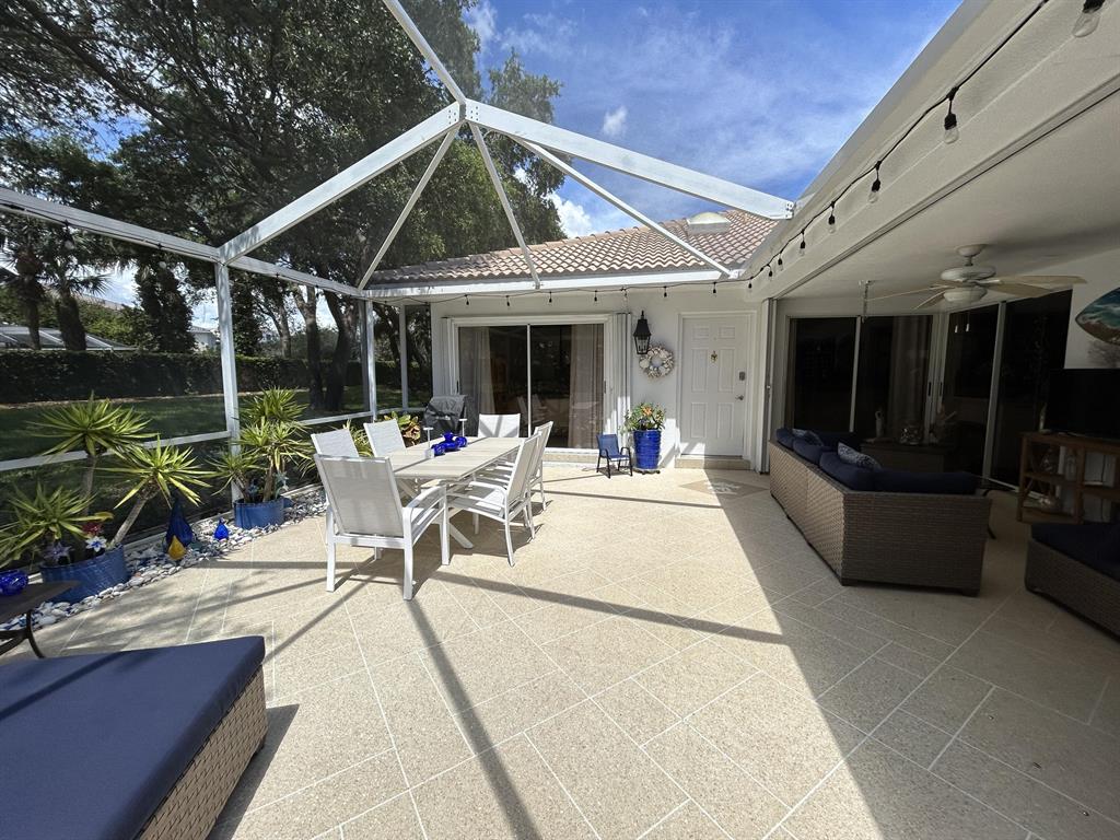 Turn key ready! This beautiful 2/2 villa is available mid-June for easy move in. A large screened patio looks out to a large garden space and is entertainment ready. The split floorplan is updated and clean with a beautiful kitchen and living space. The vaulted ceiling in the Great Room expands the area and is equipped with a large built-in for all your photos and decorations. Amenities include a heated community pool, well-lit sidewalks and on-site property manager. A/C is new in 2016 and owner is including a monthly cleaning service valued at $150 plus basic cable, water and trash. Tenant is responsible for electric, wifi and renter's insurance. Unit is just minutes from I-95, The Gardens Mall and Juno Beach among many wonderful dining and shopping options.