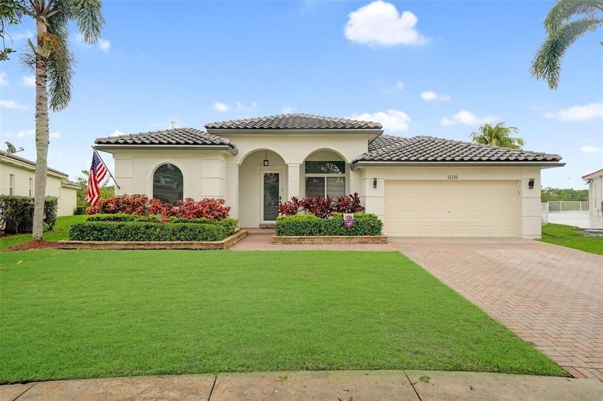 Welcome home! This Villa Rosa model home is beautiful! Featuring an open concept, single-story floor plan with over 2,000 sq. ft. & an attached 2-car garage, the home offers functionality and convenience. Enjoy the amplitude of 4 bedrooms and 3 full bathrooms, then relax in a fully screened in patio overlooking the quiet and peaceful lake. All appliances are less than 5 years old! The primary ensuite is a dream; with a tray ceiling, walk-in closet, and updated vanity. Located in West Pembroke Pines, within the gated and amenity-rich community of Pembroke Isles, residents here enjoy the luxury of 3 swimming pools, a clubhouse, basketball courts, racquetball courts, tennis courts, fitness center, aerobics studio, etc. Cable & Gigabit Fiber Optic internet included! Equal Housing Opportunity.