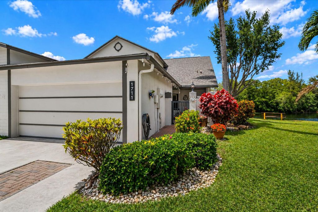 Photo of 1711 Landings Boulevard, Greenacres, FL 33413 (MLS # B26020313)