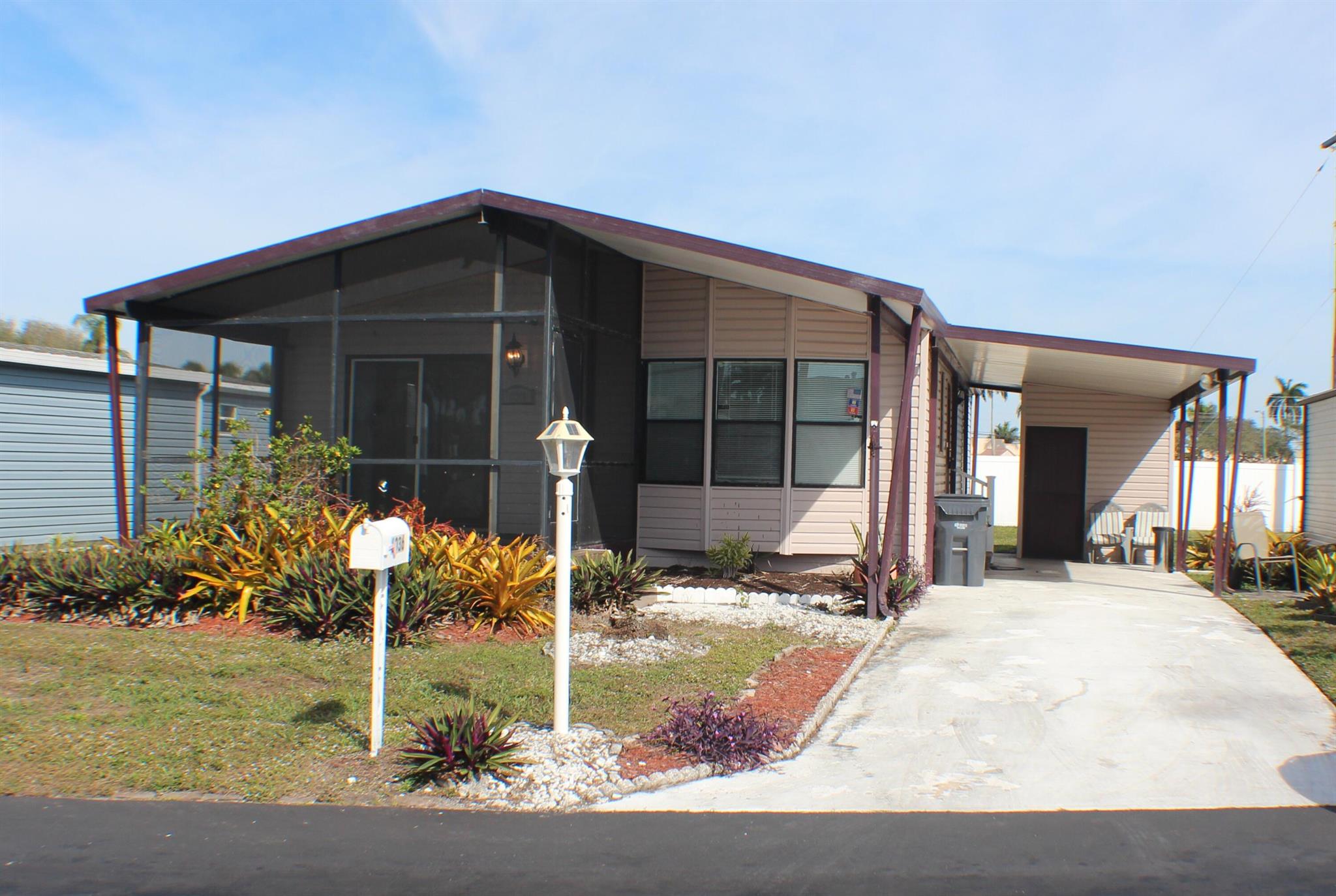 A fully-remodeled kitchen if you like to cook- restaurants on the corner if you don't! 2/2 manufactured home in 55+ community (second person can be 40+). Only 13 minutes from PBIA, 8 minutes to beaches, with new clubhouse, a pool, hot tubs, and security gate. In-unit laundry.Tenant must apply to the park management (background check). Measurements are approximate.