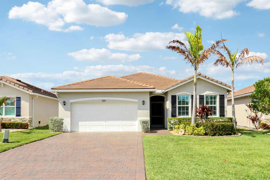 Photo of 2011 NW Golden Oak Trail, Jensen Beach, FL 34957 (MLS # B26019151)