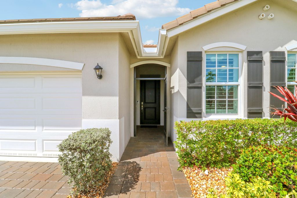 Photo of 2011 NW Golden Oak Trail, Jensen Beach, FL 34957 (MLS # B26019151)