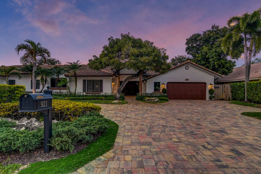 This Stunning One Story ~ Only 1 block from the park! 4BR/4Bath+Office+Lg Bonus Room with full bath can easily be 5th BR (Now used as Media/Exercise Room) New Roof, All Impact Glass & French doors ,New Garage Door, Beautiful New Island Kitchen with State of the Art JennAir appliances, Lg Breakfast area, 2 separate desk stations, Attractive Double Sided Gas Fireplace separates Formal Living & Dining Rooms, Private Master Bedroom, Wood Floors, Crown molding, Amazing Open Floorplan with East & West wings creating a 3-way split BR plan, High ceilings, Impact Skylights, New Full House Generator! Beautiful new patio with Saltwater Pool, New Landscaping & lighting, 2 Zone AC, All ''A'' Rated Schools, Close to shopping, restaurants, Mizner City Centre, Bike to Beach  Easy to show