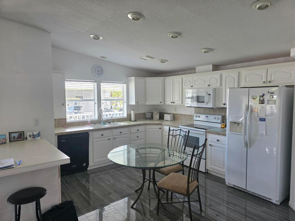 Photo of 8027 9th Hole Drive, Port Saint Lucie, FL 34952 (MLS # B26018181)