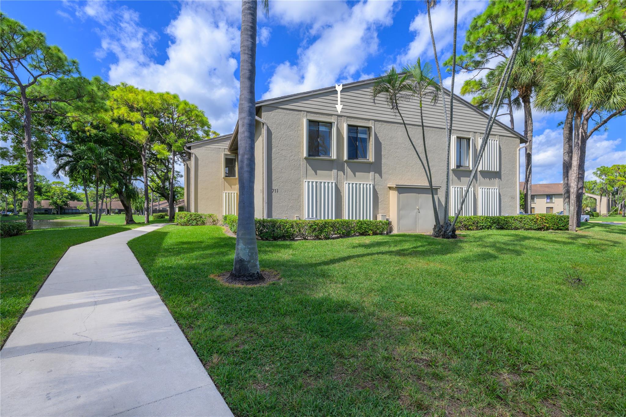 Welcome to your new stylish 3-bedroom 2-bath condominium located on a prime lake location, this spacious unit offers the perfect floor plan for modern living. The kitchen features modern appliances, lots of cabinet and counter space making it a chefs delight. The master bedroom has it's own remodeled en-suite full bathroom with double generous closets. The two additional bedrooms are comfortably versatile with large windows providing natural light and views. A screened balcony provides outdoor breakfast/dinning space with a view of the lake.
With amenities such as tennis, swimming pool, shuffleboard, and club house in an all age community close to all major roads this condo is a no brainer.
Don't miss the opportunity to make this your new home, you won't be sorry..