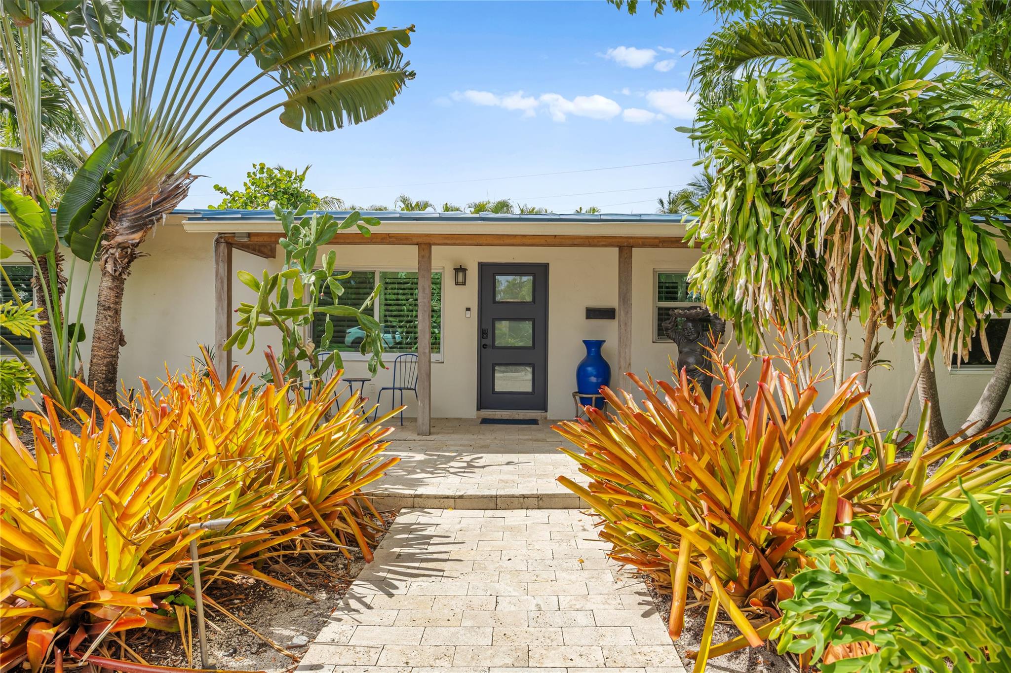 Located in the heart of Coral Ridge and within the A+ Bayview Elementary district, this 3 beds/3 baths home features a spacious split floor with recent upgrades: sleek porcelain tile floors, new kitchen with modern appliances, new impact windows and doors, spa-like bathrooms, and fresh interior/exterior paint. The private backyard oasis is perfect for entertaining, with travertine pavers, a sparkling pool, hot tub, lush landscaping with accent lighting, a built-in BBQ, and generous seating areas. Unwind in the infrared sauna after a day at the beach—just 1/2 mile away. Conveniently located near the Galleria Mall, Publix, fine dining, and entertainment. This cozy and private home is move-in ready and available for short- or long-term lease. Furniture is negotiable and pets are welcome.