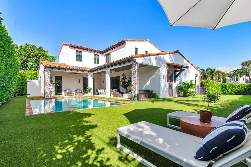 Located in the heart of SoSo on the Intracoastal block, this beautifully designed 4 bedroom, 3.5 bath home offers nearly 3,000 square feet of luxurious living space. The heart of the home features an open-concept layout where the kitchen, dining, and living areas blend seamlessly. A chef's kitchen with an AGA Elise range, dual dishwashers, and an oversized island opens to the dining area, which includes a custom bar with wine cooler and beverage fridge. The main-floor primary suite offers a dual-sink vanity, Roman tub, separate shower, private water closet, and a generous walk-in closet. Upstairs, you'll find a junior primary suite, two additional bedrooms with a shared Jack and Jill bath, and a convenient laundry room. Outdoors, a covered loggia overlooks the pool surrounded by lush, mature landscaping, a spacious yard, and an outdoor shower, perfect for relaxed Florida living. Ideally located near the Flagler Drive bike path, Worth Avenue shopping, The Blue Door, La Sirena, and the new world-class golf destination, The Park, this home truly combines comfort, style and convenience.