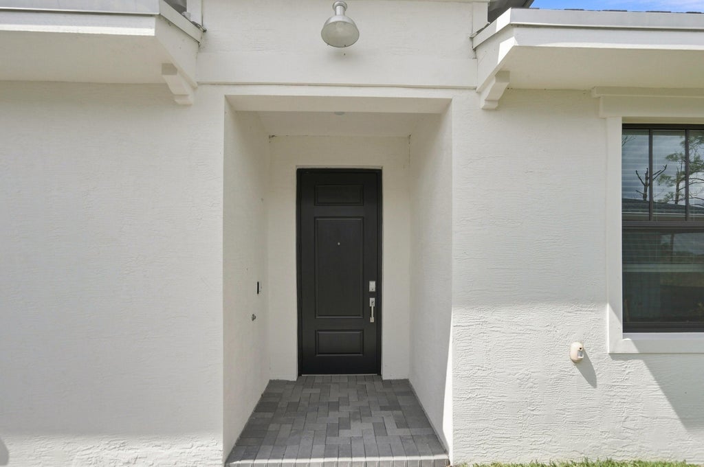 Photo of 10611 NW WILGROVE Lane, Port Saint Lucie, FL 34987 (MLS # B26073685)
