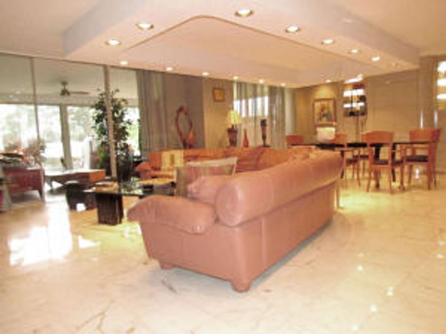 COUNTRY CLUB MEMBERSHIP NOT REQUIRED. 1yr. HOME WARRANTY COMING W. FULL PRICED OFFER. 3/2 TH converted to 2/2 to enhance living area. UNIT SOLD TURNKEY W/ORIGINAL ARTWORK & DESIGNER FURNISHINGS OR UNFURNISHED DEPENDING ON OFFER. Newer SS appliances, sit down kitchen & pantry plumbed for half bath. Lg. glass Fla. Rm. w. updated fixtures &  panoramic garden/golf views.  2 lg. bedrooms upstairs w. crown molding & renovated bath. Most of home freshly painted, some w. knockdown, walk in closet up & down, renovated bath down stairs.  Marble floors enhance living area. Experience peace & ambience of manned guard gates, 24 security patrols & storm shutters located on lush tropical grounds. Community pool & spa  out your front door.  Minutes away from turnpike, I95, shopping, restaurants & beaches.