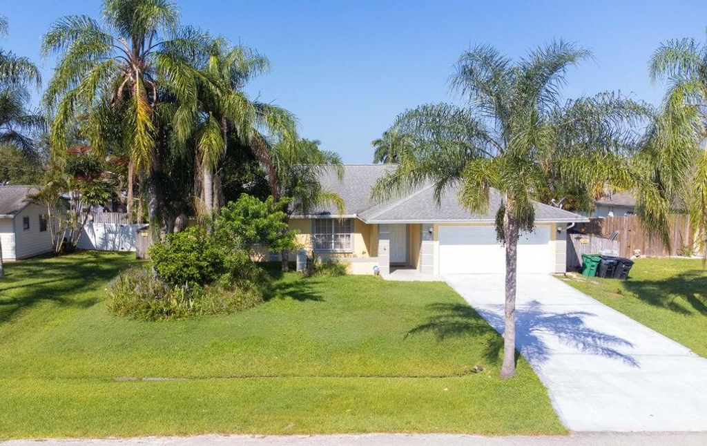 Photo of 620 SW Cynthia Street, Port Saint Lucie, FL 34983 (MLS # R10960024)