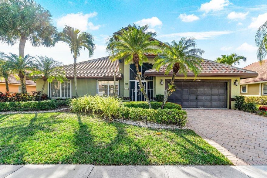 I dare you not to fall in love with this ABSOLUTELY STUNNING HOME!!! This is one of the largest LAKE FRONT homes within Lakeridge Greens with almost 2,700 sq. ft. of living space and the home is being sold partially furnished. The seller has spared no costs with a NEW ROOF (2023), ENTIRE HOME GENERATOR, 2-ZONE AC (4 ton replaced in 2023), UPDATED EAT-IN KITCHEN that will excite any Chef with high end SS appliances, undermount lighting, custom stone & tile backsplash, quartz countertop, custom cabinetry, custom glass cabinets with interior lighting, large pullout drawers, a spice rack, soft close doors & drawers, a coffee bar, a cooktop stove, and a TV that is hidden behind the cabinetry which adjusts up and down with a remote. Both the microwave and over are confection. There is also custom window treatments that adorn just about every the window. Off of the family room there is a glass enclosed lanai with it's own central AC unit and is being used as additional living space which provides spectacular long lake views. You can see the most amazing sunsets while sitting in this room. The primary bedroom suite has hardwood floors, plantation shutters, a sumptuous bathroom with a jacuzzi tub, step down glass enclosed shower, wood cabinetry, custom lighting, and a custom fitted walk-in closet.  This home offers so much that you must see it for yourself.  Lakeridge Greens is part of the Lakes of Westchester community, offering a newly renovated clubhouse with social events and clubs, a vibrant tennis community, tennis courts, a pickleball court, an 18-Hole Golf Course, an Olympic-sized pool, and a hot tub. Residents can also enjoy the amenities of the public Westchester Country Club at no additional cost. The HOA fee covers security, cable with some premium channels, internet, lawn care and power washing of the roof. This is your opportunity to embrace the luxurious lifestyle offered by this exceptional home in Lakeridge Greens. 
EXCLUSIONS: Dining Room Chandelier & Lalique foyer/ entry sconce.