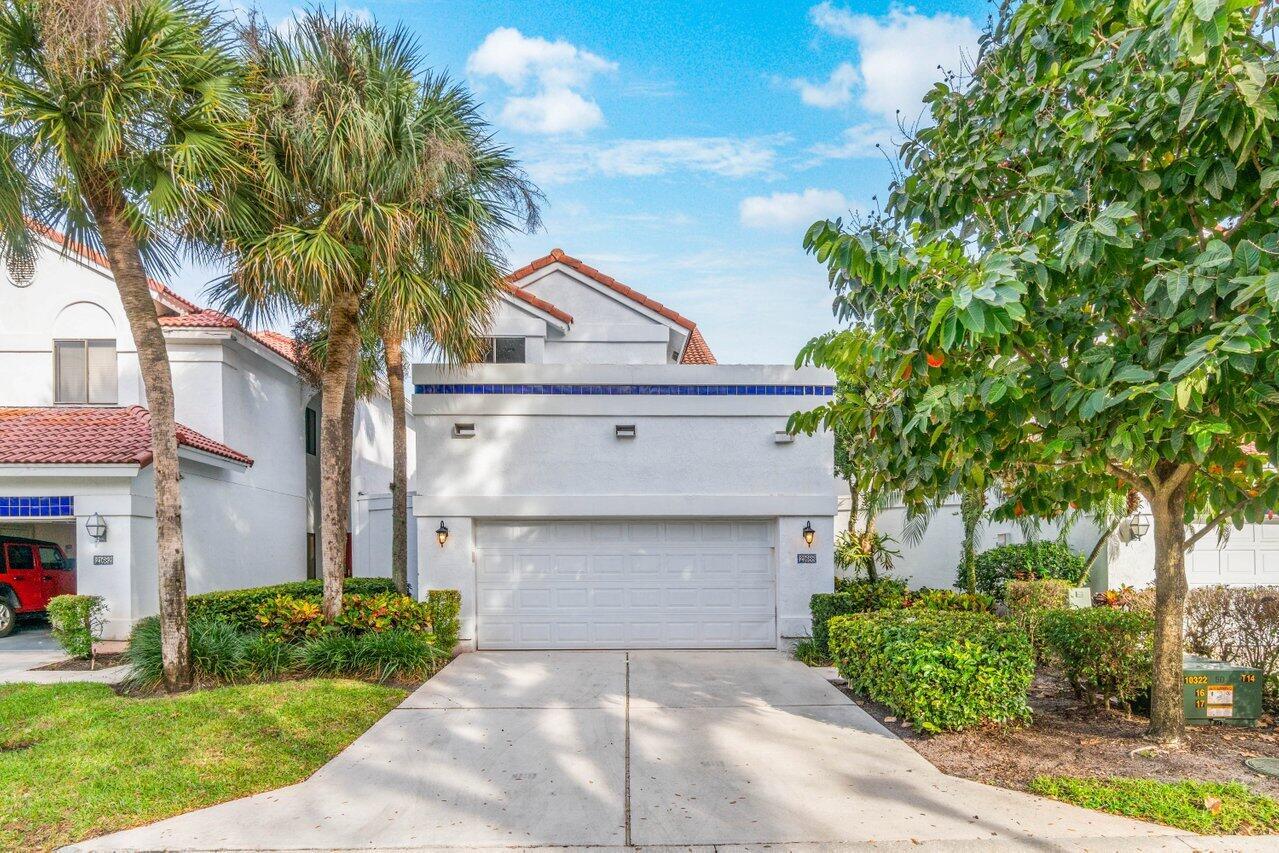 Beautifully updated two-story home located in the best Town Center location. Bright, open floorplan features dual master suites (one up & one down) plus an open loft/third bedroom w/walk-in closet. Soaring ceilings & an abundance of natural light enhance the spaciousness of this home. The interior showcases porcelain floors & wood plank flooring in the bedrooms. Updated open kitchen is designed w/quartz countertops, center island & stainless steel appliances. Bathrooms have been beautifully updated. Smooth ceilings add a modern finish. The home also features a 2CG plus large storage room. The backyard adds outdoor living space perfect for relaxing & entertaining. Recent updates include hurricane impact doors/windows, new AC, dishwasher & hot water heater. Heated community pool & spa.