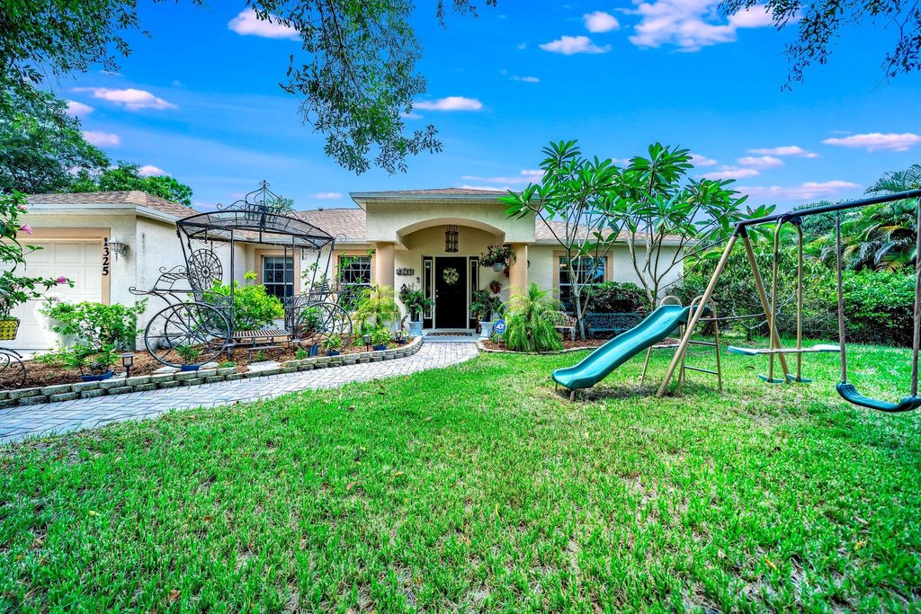 Photo of 1325 Bennett Road Rd, Fort Pierce, FL 34947 (MLS # R10817177)