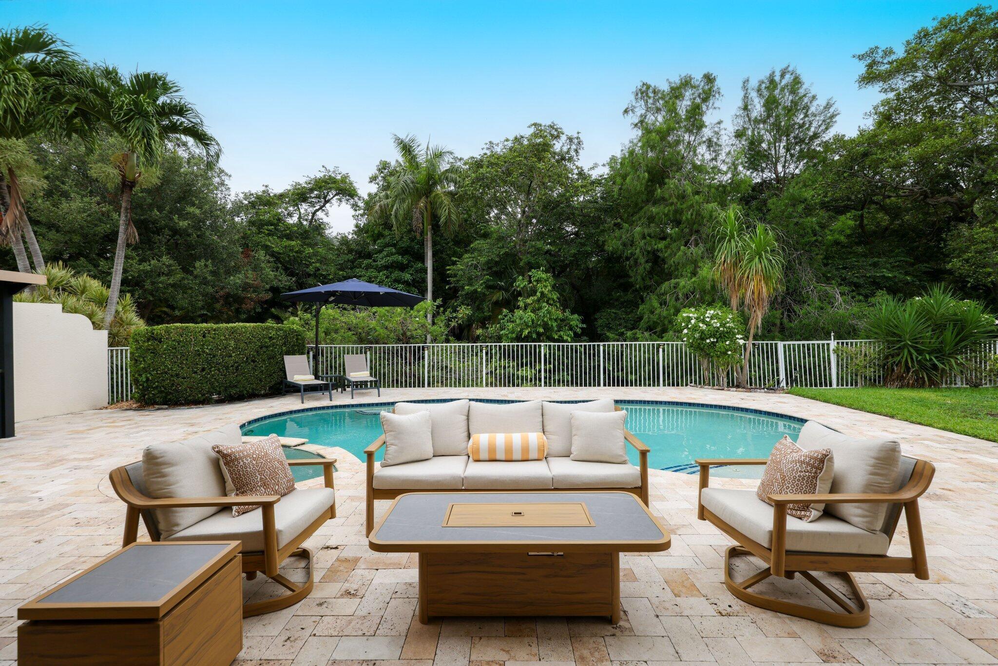 Welcome to Delray living at its finest! This 3 bed + den single family home in the tree lined, gated community of Hammock Reserve has been completely updated. As you enter, you'll be greeted with an excess of natural light and 12 foot ceilings. This oversized lot, with a preserve view and stunning pool & spa is an entertainers dream. With a full kitchen renovation, this residence offers brand new cabinetry, countertops, and KitchenAid appliances as well as a freshly renovated primary bathroom, with new tile, shower, soaking tub, vanities and more. Additional upgrades include extensive landscaping, phantom screens installed for comfortable outdoor entertaining, built in pantry/ bar added to the living room, all new light fixtures and high hats, and a full-house water filtration system.