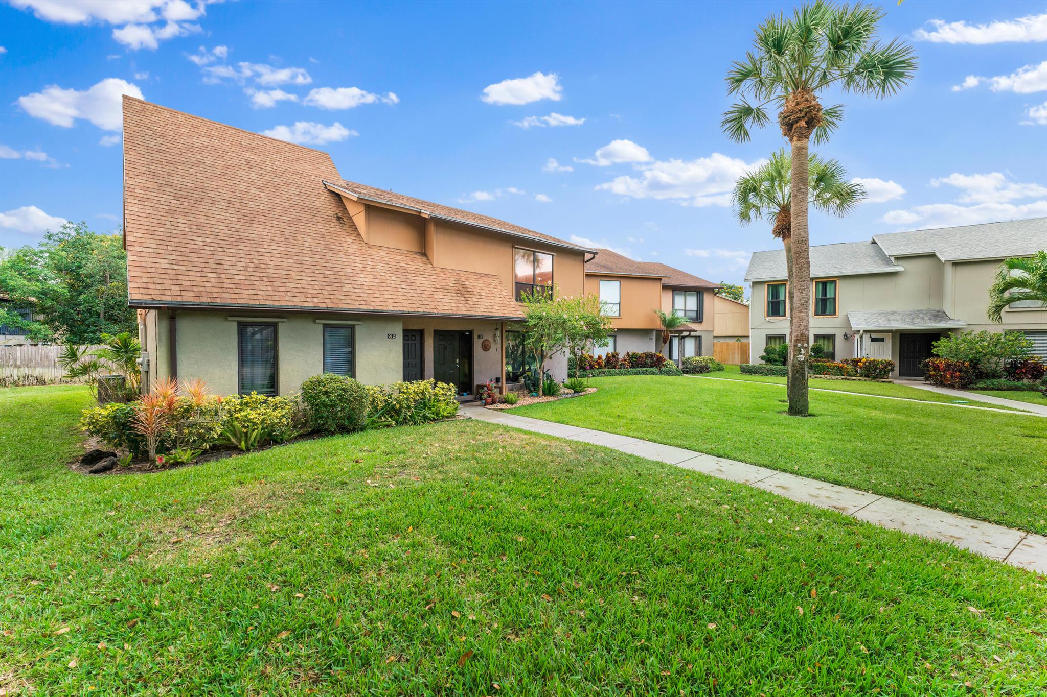 BEST BUY IN PALM BEACH GARDENS! This two bedroom, two full and one half bath with laundry, two story townhome is ready for new owners. With a freshly painted exterior this townhome boasts incredible natural light, a spacious living room, kitchen/dining combination that leads to an enclosed back patio perfectly fit for outdoor dining. Throughout the entire first floor you will find new Beachwood style tile. Upstairs you will find two bedrooms with en suite baths that were recently renovated the last three years. Priced to SELL! NEW HVAC! Perfectly located close to 95, shopping and dining! Schedule your tour today.
