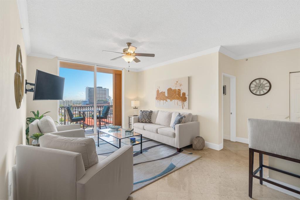 Rarely available, immaculately designed, penthouse unit in the heart of Rosemary Square in downtown West Palm Beach! This unit is offered fully furnished and turnkey, all you need is your toothbrush. New floors and a remodeled kitchen are the icing on the cake. You are just steps away from all the best restaurants and shopping in the area. North-facing balcony provides views of intracoastal and ocean as well as the city. This unit is perfect for someone looking for a seasonal/forever home OR an investor looking for a hot vacation rental property as the building has favorable rental rules and rents extremely well due to its location. This is one of the best units in one of the best buildings that downtown West Palm Beach has to offer!