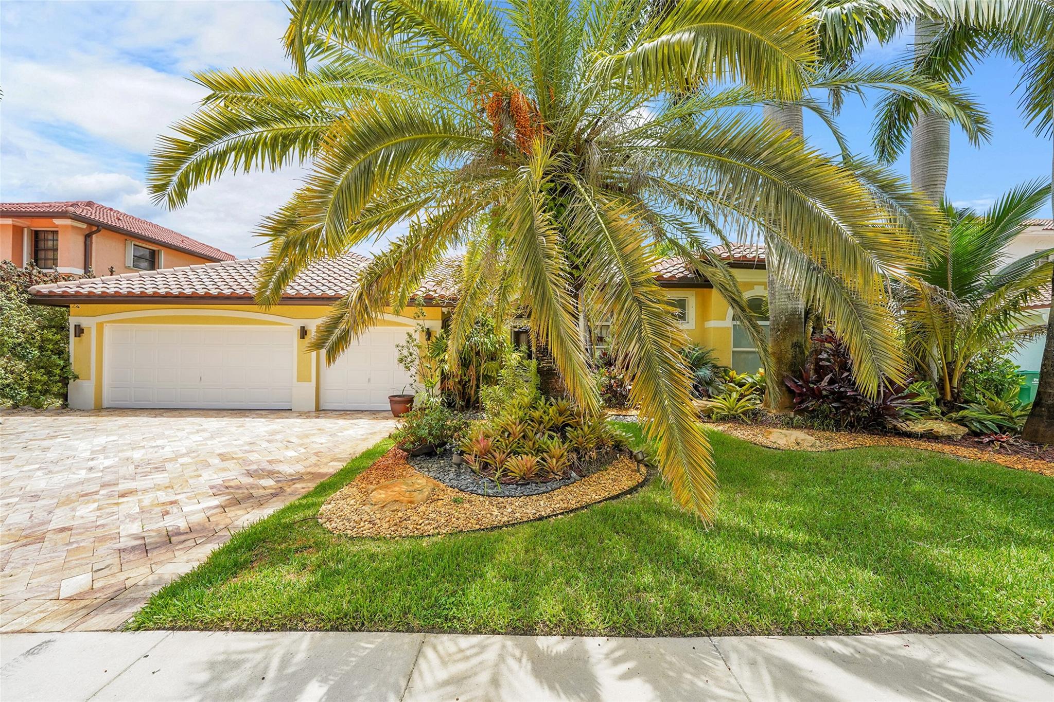 WELCOME TO THIS BEAUTIFULLY MAINTAINED 5-BEDROOM, 3.5-BATHROOM RESIDENCE WITH A VERSATILE DEN, LOCATED IN THE PRESTIGIOUS GATED COMMUNITY OF ISLES OF SUNSET LAKES. THIS EXPANSIVE SINGLE-STORY HOME FEATURES LUSH, PROFESSIONALLY LANDSCAPED GROUNDS AND A BRAND-NEW ROOF, ALONG WITH HURRICANE-IMPACT WINDOWS THROUGHOUT FOR ADDED PEACE OF MIND. ENJOY AMPLE LIVING SPACE, A 3-CAR GARAGE, AND AN INVITING BACKYARD OASIS COMPLETE WITH A PRIVATE POOL AND ADJACENT TIKI BAR—PERFECT FOR ENTERTAINING. THE HOA FEE INCLUDES CABLE, THE INTERNET, AND A HOME SECURITY ALARM SYSTEM. RESIDENTS HAVE ACCESS TO A RESORT-STYLE CLUBHOUSE OFFERING A WIDE RANGE OF AMENITIES, INCLUDING A COMMUNITY POOL, TENNIS COURTS, PLAYGROUNDS, AND A FULLY EQUIPPED FITNESS CENTER.