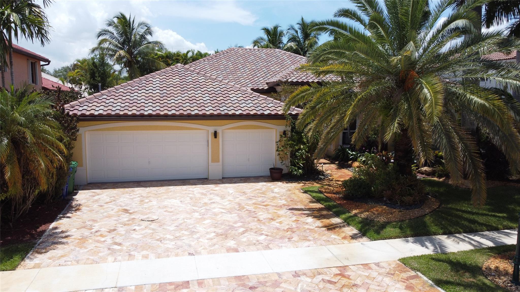 WELCOME TO THIS BEAUTIFULLY MAINTAINED 5-BEDROOM, 3.5-BATHROOM RESIDENCE WITH A VERSATILE DEN, LOCATED IN THE PRESTIGIOUS GATED COMMUNITY OF ISLES OF SUNSET LAKES. THIS EXPANSIVE SINGLE-STORY HOME FEATURES LUSH, PROFESSIONALLY LANDSCAPED GROUNDS AND A BRAND-NEW ROOF, ALONG WITH HURRICANE-IMPACT WINDOWS THROUGHOUT FOR ADDED PEACE OF MIND. ENJOY AMPLE LIVING SPACE, A 3-CAR GARAGE, AND AN INVITING BACKYARD OASIS COMPLETE WITH A PRIVATE POOL AND ADJACENT TIKI BAR—PERFECT FOR ENTERTAINING. THE HOA FEE INCLUDES CABLE, THE INTERNET, AND A HOME SECURITY ALARM SYSTEM. RESIDENTS HAVE ACCESS TO A RESORT-STYLE CLUBHOUSE OFFERING A WIDE RANGE OF AMENITIES, INCLUDING A COMMUNITY POOL, TENNIS COURTS, PLAYGROUNDS, AND A FULLY EQUIPPED FITNESS CENTER.