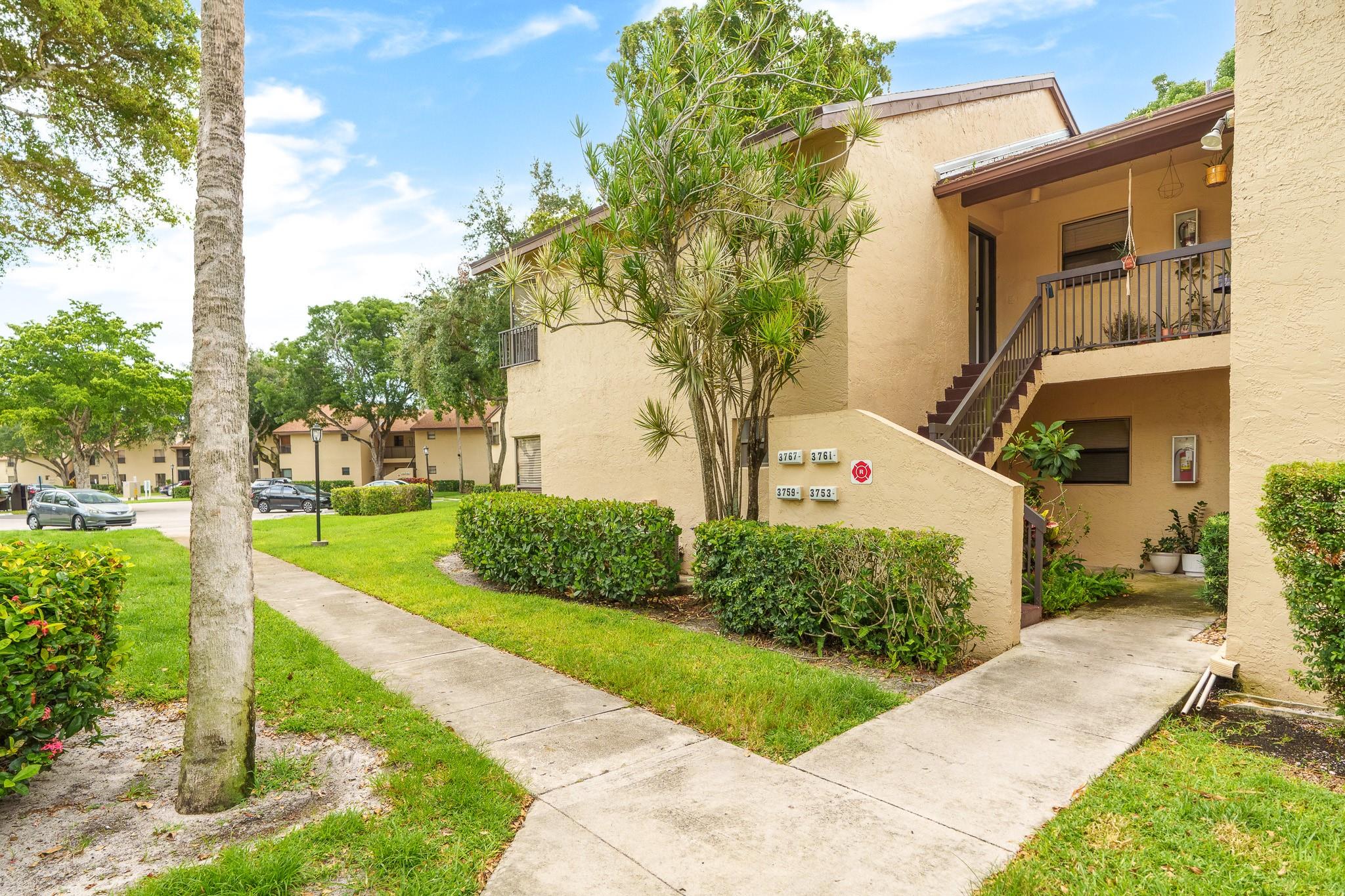 Welcome to this 2-bedroom, 2-bathroom corner unit, featuring a renovated split floor plan, screened-in patio, complete with a full-size washer and dryer. The kitchen has been upgraded with quartz countertops, white cabinets, and stainless-steel appliances. This spacious split floor plan boasts oversized bedrooms, with a generous walk-in closet in the principal bedroom, and wood laminate flooring throughout. This home is just a short drive to from the Florida Turnpike, a variety of restaurants and shopping centers, including the The Promenade. Enjoy exclusive access to a wealth of amenities including a theater, an Aquatic Center—all complemented by a cutting-edge two-story Athletic Club equipped for all your fitness needs, tennis, racquetball, and basketball courts, along with pickleball.