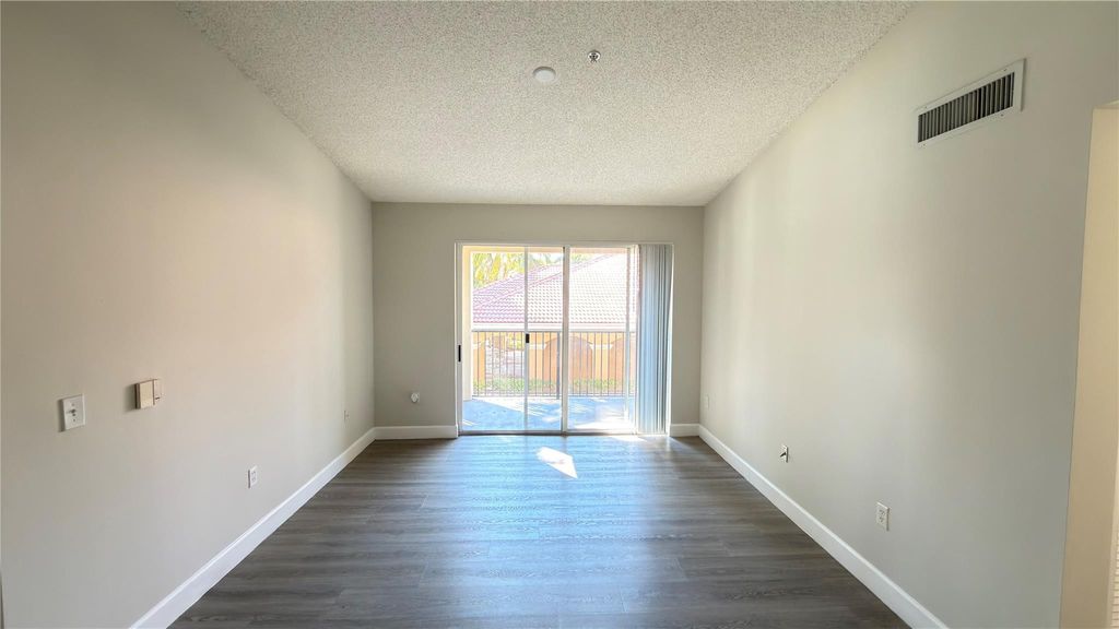 Photo of 8000 N Nob Hill Road #202, Tamarac, FL 33321 (MLS # F10531618)