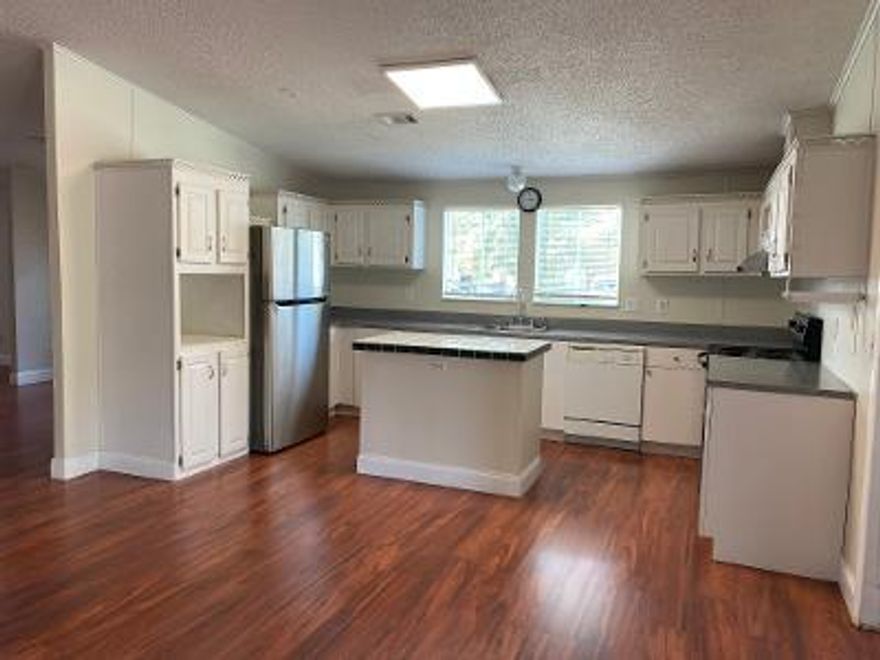 READY to move in .. Corner fenced lot, Over 1700sqft;Spacious 3 bedroom 2bath manufactured home. Formal dining room, area, living room & family room. Open kitchen Laminated Wood floors throughout. Newest Energy saving AC system, Washer and Dryer inside the hse. Great A rated schools. Close to Publix, shopping, SR441, Turnpike; Convenient location. Tenant pay all utilities and lawn Care and pest control.  24hours notice for viewing. Txt listing agent.