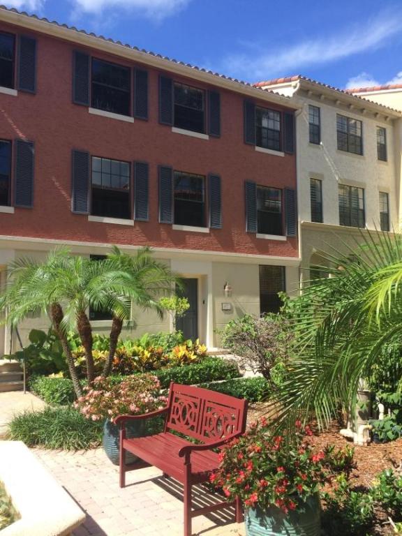 Rarely available three-story courtyard townhome in the heart of CityPlace! Located on lushly landscaped courtyard that is peaceful, private, and secure. Lower level tiled throughout, has a large den (property appraiser records show the den as the third bedroom), powder room, two-car garage. Main level has wood flooring in the living and dining areas, upgraded kitchen has tile floors, granite counters, stainless steel appliances, full-size side-by-side W/D. Upper level has a large master suite with two walk-in closets, wood flooring, and double sinks in the bath. Guest suite upstairs has wood floors, a wall of closets, and an en-suite bath. Small dog considered on a case by case basis; sorry, no cats. Walk to Publix, shopping, dining! Interior pics show furnishings from a previous resident.