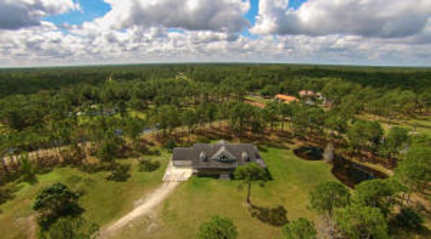 MOTIVATED SELLER :) YOU WILL FEEL AS IF YOU ARE ON A VACATION IN THE CAROLINA MOUNTAINS!! GREAT ROOM WITH SOARING WOOD CEILINGS,REAL WOOD FLOORS ADD TO THE CHARM OF THIS HOME.PLENTY OF NATURAL LIGHT POURS THROUGH THE MANY WINDOWS AND FRENCH DOORS. SUNNY BREAKFAST ROOM OVER LOOKING YOUR SPRAWLING 5 ACRE TRACT. OVERSIZED TWO CAR GARAGE WITH FULL BATHROOM. OVER 1,528 SQ.FT. OF WRAP AROUND PORCH! LOCATION IS ONE OF THE BEST WITH EASY ACCESS TO COMMUNITY PARK/EQUESTRIAN CENTER! COULD BE THE PERFECT HORSE FRIENDLY PROPERTY! DON'T MISS YOUR OPPORTUNITY TO LIVE IN THIS WONDERFUL COMMUNITY!