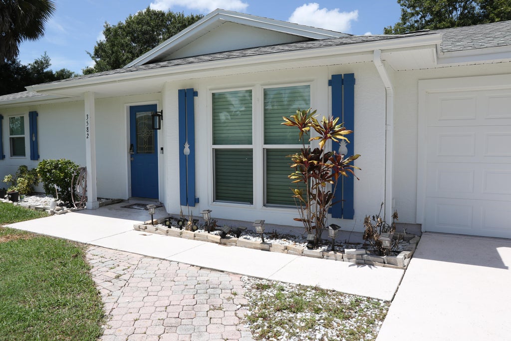 Photo of 3582 SW VOLLMER Street, Port Saint Lucie, FL 34953 (MLS # B26068781)