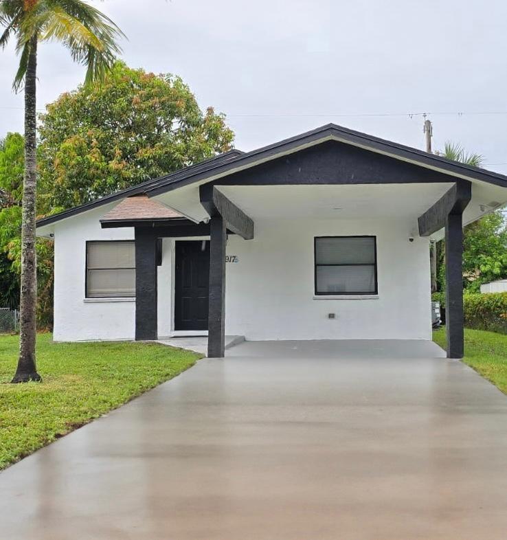 Welcome to this beautifully updated 3BR/2BA CBS home with carport, dining room, spacious living area, separate laundry room with physical washer & dryer, and NO HOA! Built in 1990, it offers a solid structure with modern touches: freshly painted inside & out, new laminate in bedrooms, nice kitchen & baths, brand-new stainless steel appliances, 2-yr-old water heater. Primary suite has en suite bath & walk-in closet. Generous room sizes, functional layout. Great as a forever home or rental (3/2s in area rent up to $3,421/mo). New construction nearby. Minutes to Turnpike & I-95.