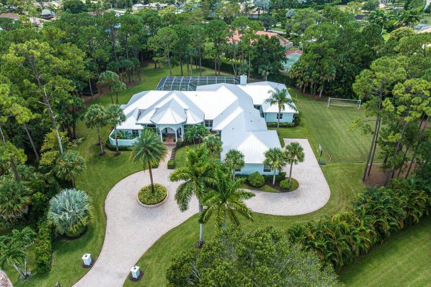 This elegant one of a kind home in the heart of Wellington WILL NOT LAST LONG! The moment you walk through the grand front entrance, you are greeted with towering ceiling heights and a picturesque view of the pool that will take your breath away. This expansive beauty, fully remodeled in 2021, boasts 6 bedrooms and 6 bathrooms on a single floor and is truly an enormous residence.  The open and modernized floorplan coupled with 2 huge kitchen islands and a sleek wet bar lounge lends itself to luxury entertaining at its finest. The gorgeous high end kitchen is fitted with SMART appliances including separate 36'' Monogram refrigerator and freezer, French door Monogram double ovens, and a Fulgor Milano induction range. Nestled on a 1.5 acre property in a quiet cul-de-sac, this distinctive...