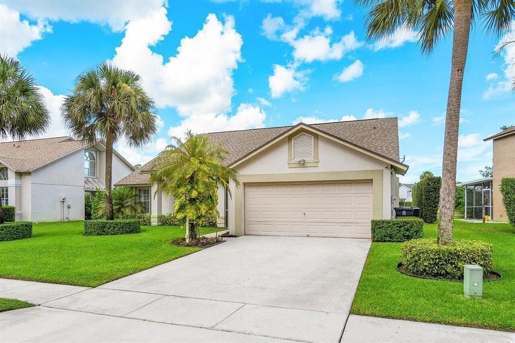 Photo of 3598 Woods Walk Boulevard, Lake Worth, FL 33467 (MLS # F10530226)