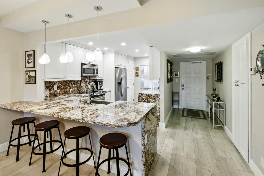 Photo of 808 Cypress Boulevard #106, Pompano Beach, FL 33069 (MLS # B26092200)
