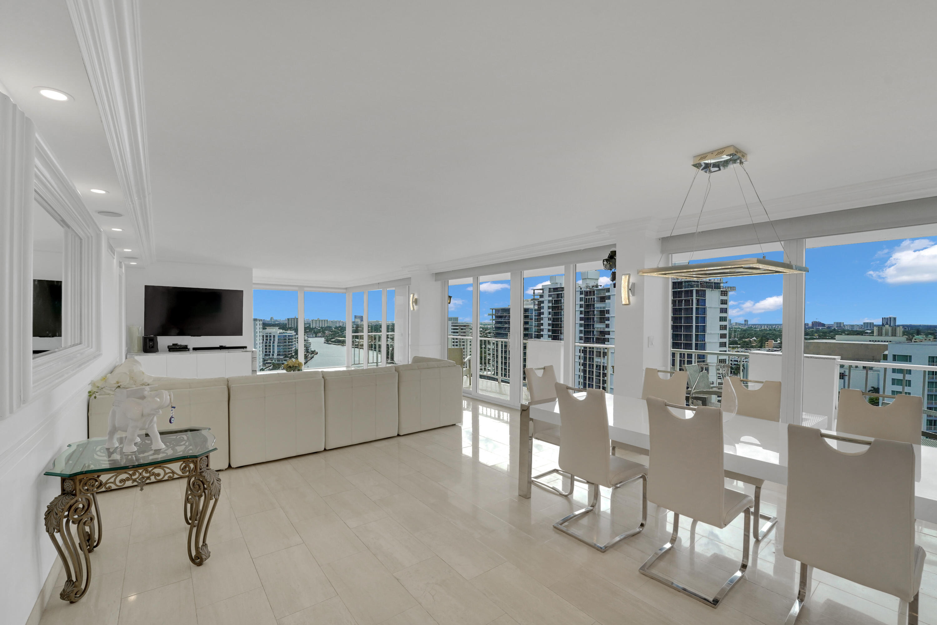This meticulously renovated 3/2.1 penthouse offers breathtaking, panoramic views of the ocean, Intracoastal Waterway, and city skyline. With a spacious and open floor plan, the residence is bathed in natural light, providing an inviting atmosphere throughout.Featuring floor-to-ceiling hurricane-impact windows and doors, a semi-private elevator, and top-tier security with a 24-hour guard, this property ensures both comfort and peace of mind. 40& 50 year inspections Completed...Enjoy exclusive amenities, including a rooftop heated pool, fully equipped fitness center, BBQ area, Drop off Boat Dock, and a 40-foot private balcony, ideal for relaxation or entertaining...Located just moments from the beach, fine dining, cafes, the renowned Las Olas, Galleria Mall, and next to Birch State Park