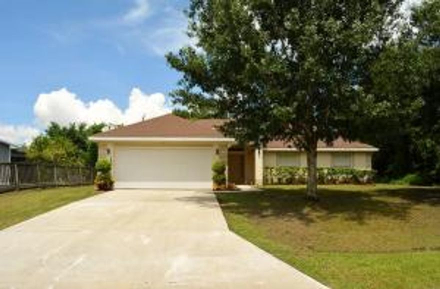 CBS Home in a well kept quiet neighborhood! Very clean and spacious home with wood laminate flooring, vaulted ceilings and large back yard plus much more....