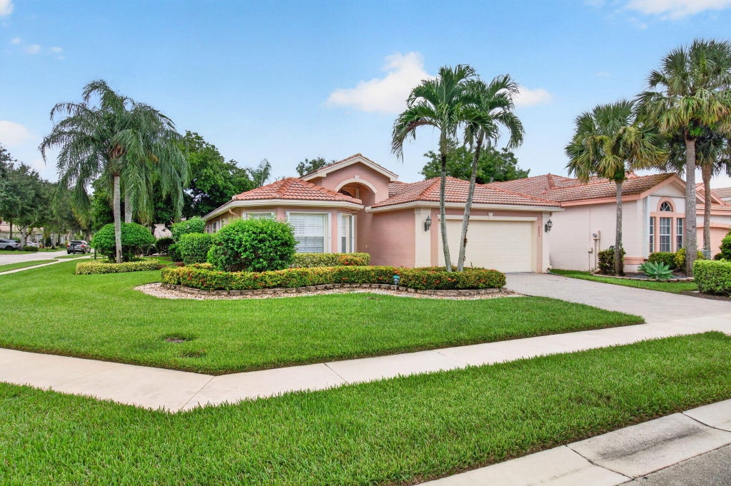 Photo of 9895 TALLYRAND Drive, Lake Worth, FL 33467 (MLS # B26062608)