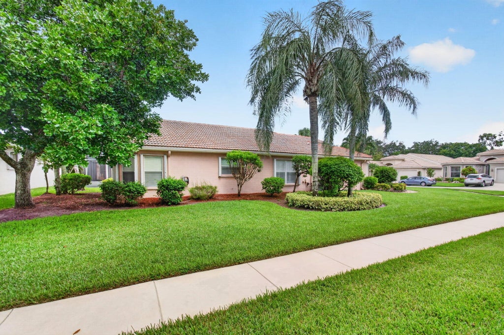 Photo of 9895 TALLYRAND Drive, Lake Worth, FL 33467 (MLS # B26062608)