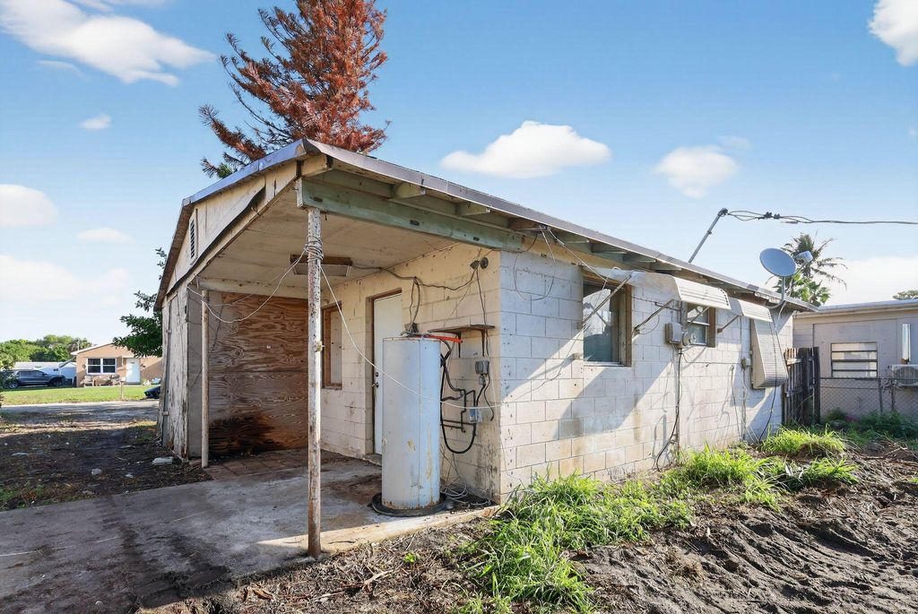 Photo of 4138 Faith Street, West Palm Beach, FL 33406 (MLS # B26003574)