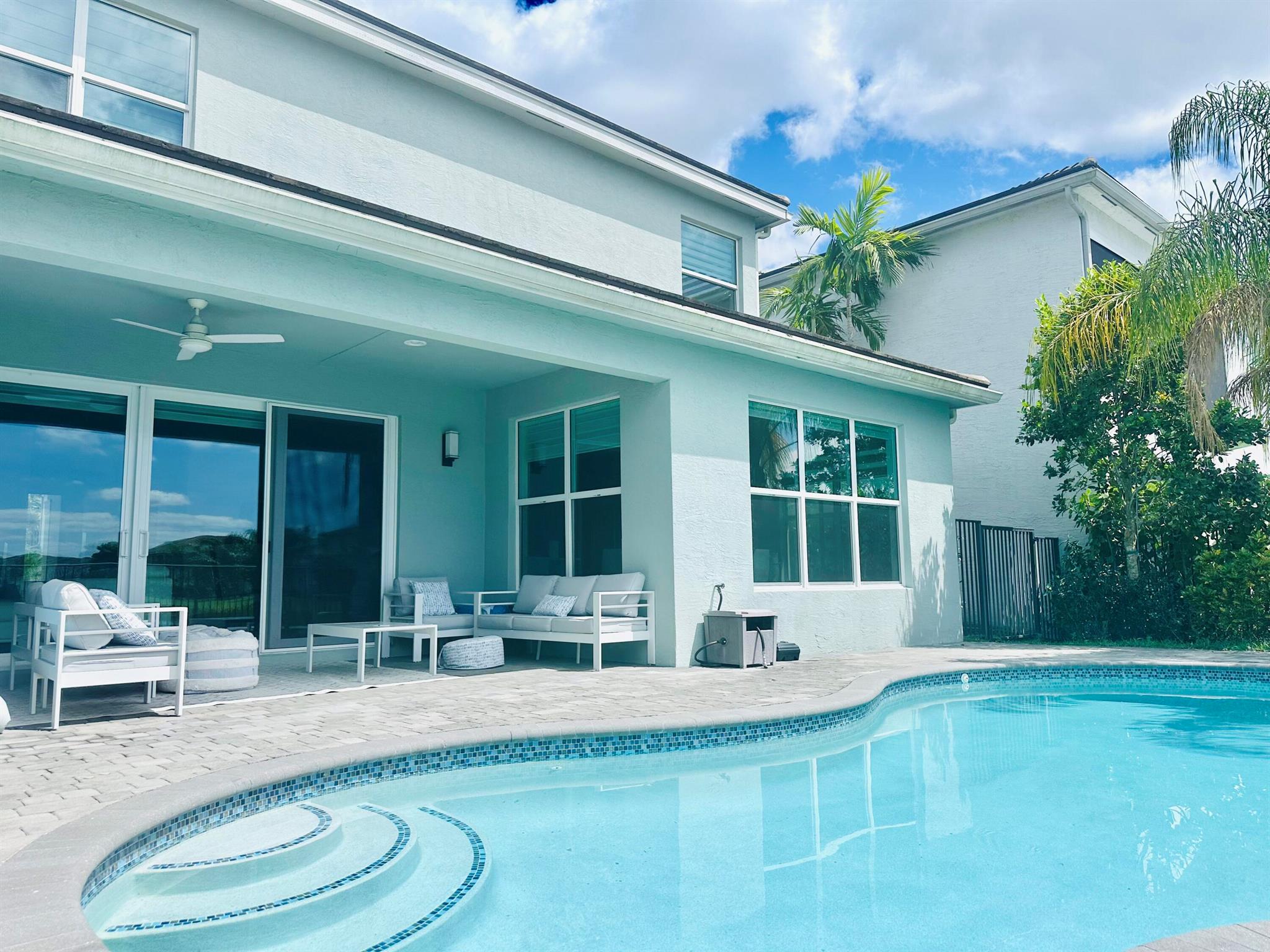 Discover your dream home in this luxurious 6-bedroom, 5-bathroom house with stunning lake views. Relax in the tranquility of your private swimming pool, just 15 minutes away from beautiful beaches. Located in a prestigious, gated community known for its safety and vibrant neighborhood events, this home is perfect for families. Top-rated schools are easily accessible with direct bus service from the clubhouse. The subdivision offers exceptional amenities, including a basketball court, clubhouse, fitness center, on-site manager, pickleball courts, picnic area, play area, playground, pool, sidewalks, spa-hot tub, street lights, and tennis courts. Schedule a viewing and experience the perfect blend of luxury, convenience, and community living.