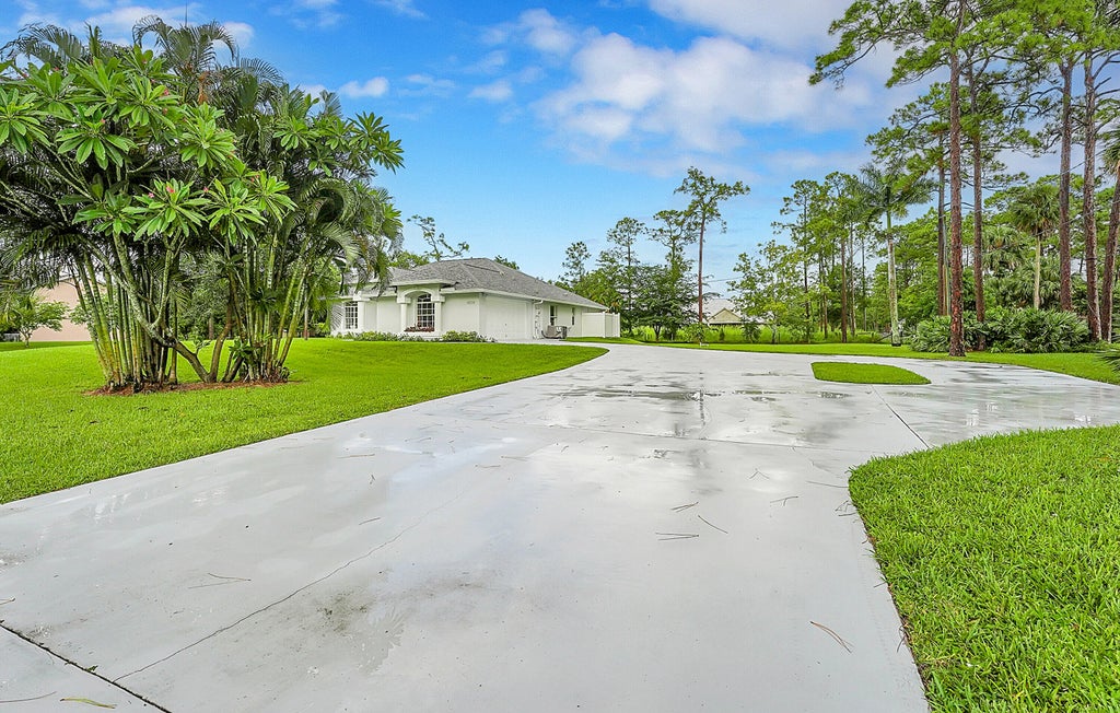 Photo of 12315 63rd Lane N, The Acreage, FL 33412 (MLS # R11014666)