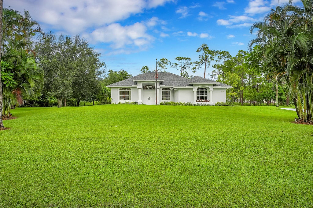 Photo of 12315 63rd Lane N, The Acreage, FL 33412 (MLS # R11014666)