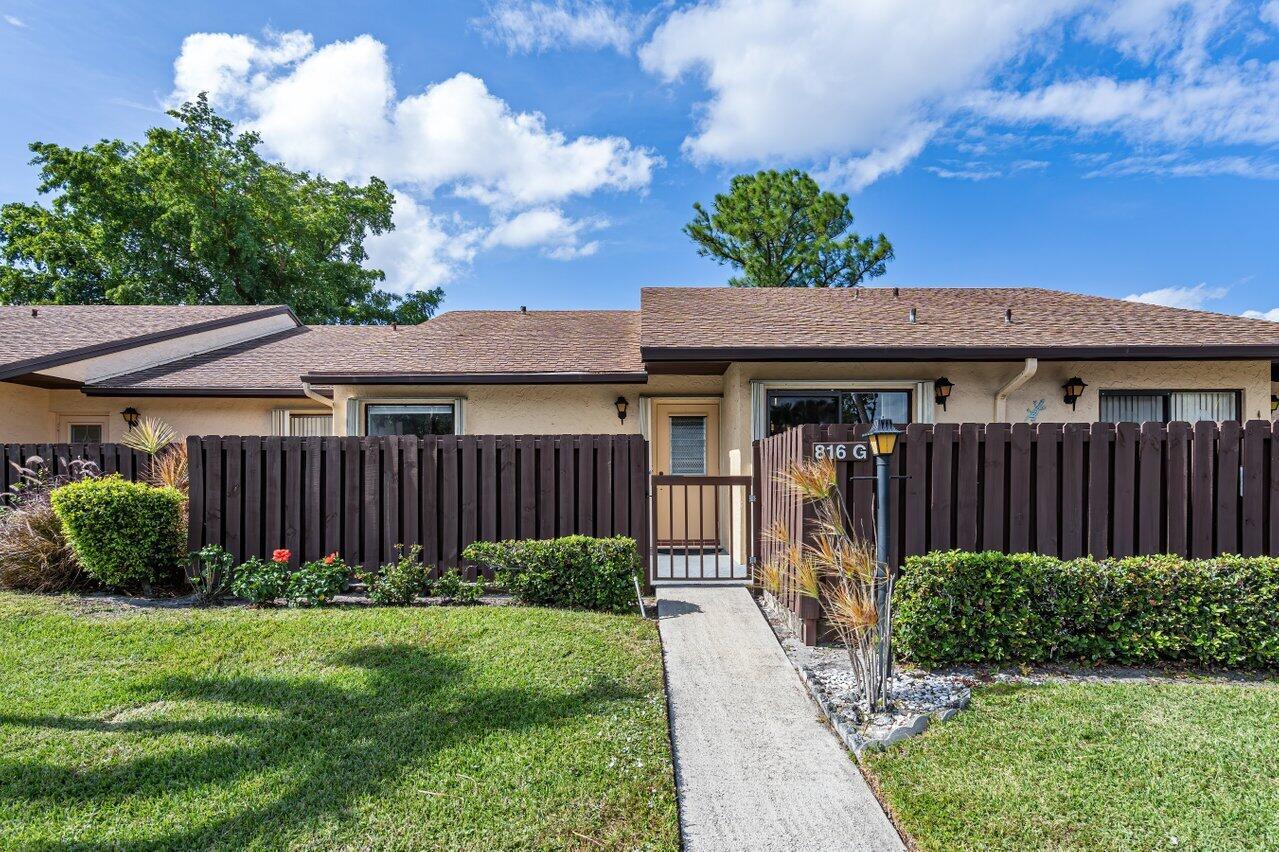 ADULT COMMUNITY 55+, LAKE VIEW BEAUTY! Investment opportunity no waiting period for rental. This villa floor plan with 2 bedrooms, 2 bathrooms, Florida room with storage room. The ceilings with NO popcorn texture, all tile flooring, upgraded light fixtures and ceiling fans. Remodeled kitchen with custom cabinetry, granite countertop, tile backsplash, stainless steel appliances. Washer and dryer installed 2021, Air conditioning 2016, accordion shutters for windstorm protection. Master bedroom with spacious walk-in closet and updated bathroom. The fenced courtyard is great for enjoying Florida weather and outdoor grill. LOW association fee includes amenities, CABLE, WATER. exterior maintenance, exterior building insurance, roof, & fence. Pick-up truck & motorcycle allowed, 1 pet 25 lbs.