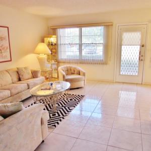 First floor 2 bedroom in Fantastic Wynmoor! Very clean bright unit with lake and fountain view! Enjoy South Florida living at its best. Bus service, Clubhouse, theater, 19 pools, golf course, Gated community, minutes from shopping and just miles from the beach!55+