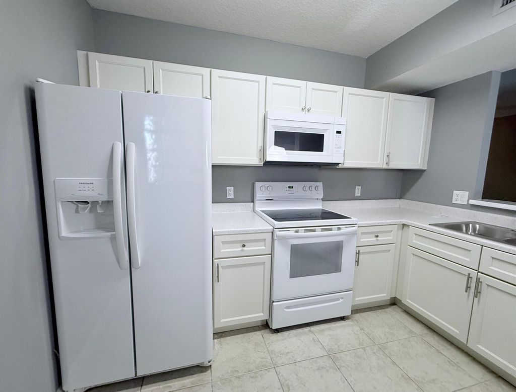 Photo of 1115 Golden Lakes Boulevard #512, West Palm Beach, FL 33411 (MLS # R11128903)