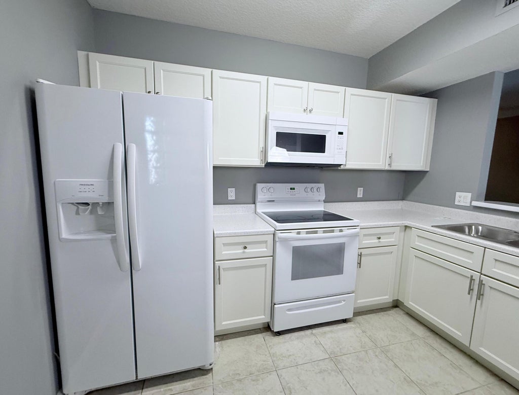 Photo of 1115 Golden Lakes Boulevard #512, West Palm Beach, FL 33411 (MLS # R11128903)