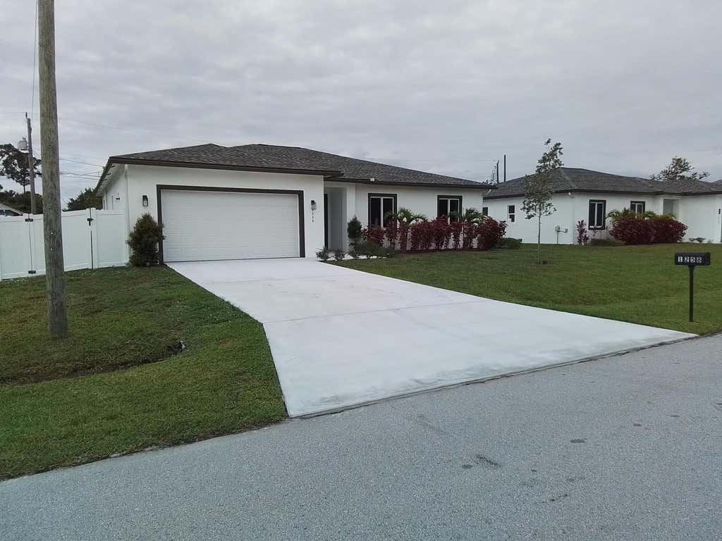 Photo of 1258 SW Santiago Avenue, Port Saint Lucie, FL 34953 (MLS # B26047361)