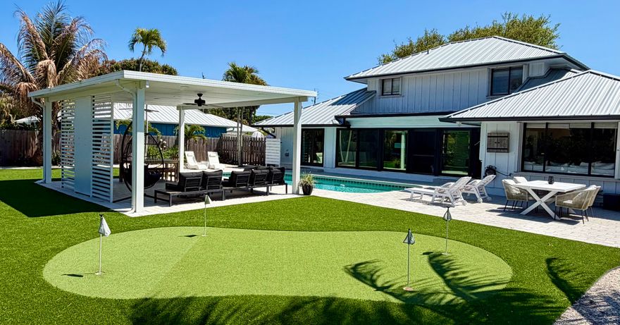 This exceptional home in the highly sought-after Tequesta area is situated on a quiet cul-de-sac and offers a variety of premium features. Recent upgrades include a three-year-old metal roof and a new driveway with ample parking for an RV, boat, or multiple vehicles. The home is well-protected with an impact glass front door, sliding glass doors, and accordion shutters for the remaining windows. The new appliances include double ovens, oversized built-in separate refrigerator and freezer units, wine refrigerator in bar area, amazing new washer/dryer combo unit, 2 A/C units, one of which is only a year old. The main ensuite bath features a soaking tub, walk-in shower and double vanities. A full powder room with shower and the second-floor bath has a tub/shower combination. Beautiful family room and games rooms make family time fun! This home has everything, is the perfect home for entertaining and is surrounded by multi-million dollars mansions! Move in Ready! Must see!