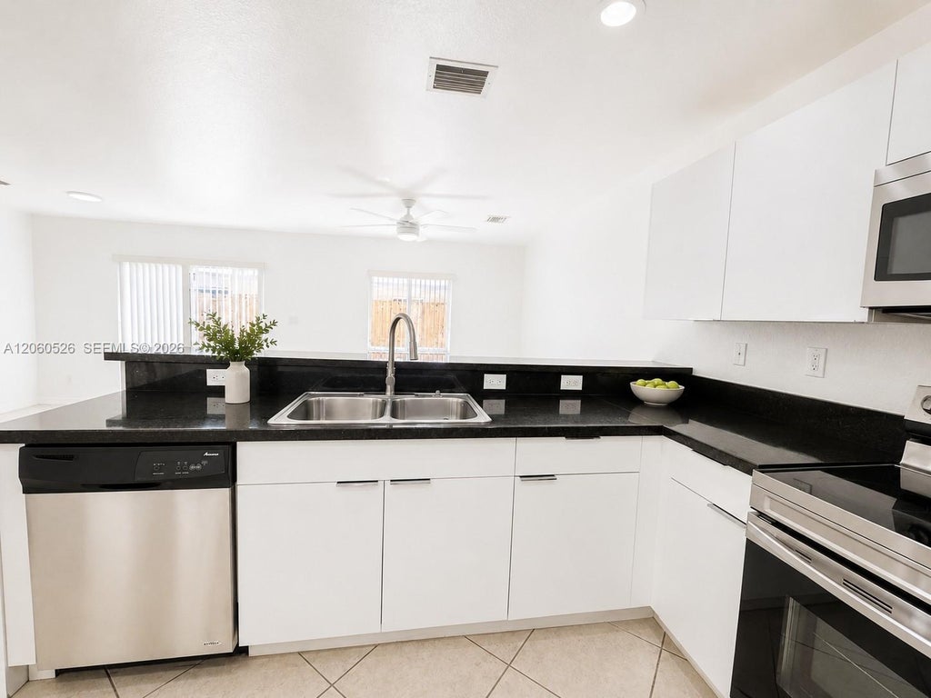 Photo of 324 NE 3rd Street #D, Hallandale Beach, FL 33009 (MLS # A12060526)
