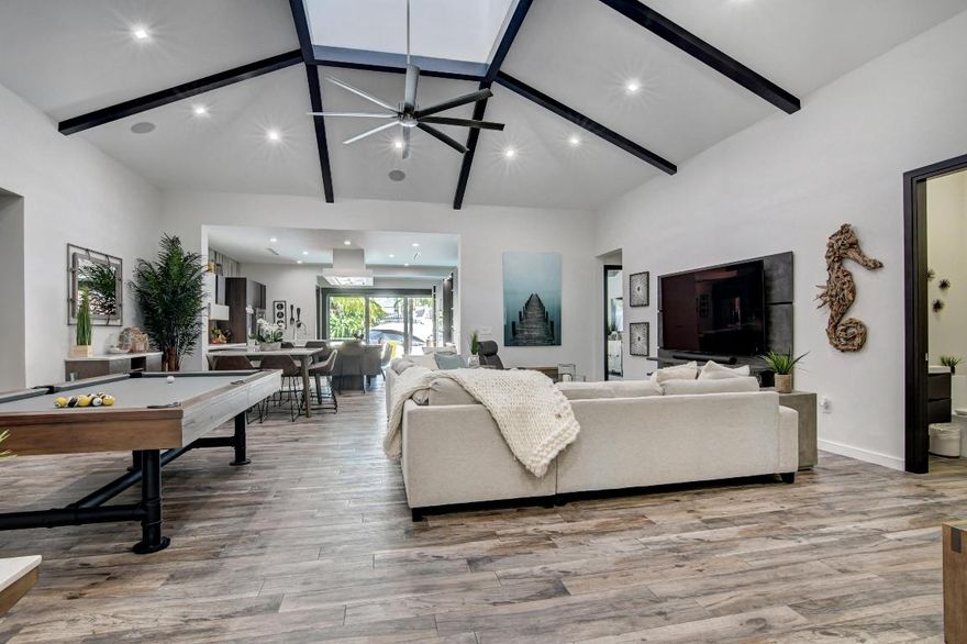 Your own intracoastal 3BR/3.5BA paradise perfectly located in Seven Isles by the beach, the main channel, and all the shops and restaurants of Las Olas. The finest outdoor living space with a saltwater pool, hot tub, and sandy beach next to 75 ft of deep water, with no fixed bridges. Greeted with large double doors to a spacious great room with vaulted ceilings and natural light from above. Kitchen has custom cabinets, quartz counters & natural gas cooking with new hood. Three split bedroom suites with their own full baths & custom closets, plus den/4th BR. Master bedroom has two walk-in closets & stackable glass doors to the pool/waterway for a beautiful morning and evening view. Master bath has dual sinks, separate spa tub & shower. Complete rebuild in 2015. Must see.