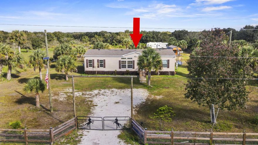 Beautiful 3-bedroom, 2-bathroom home on 1.25 acres, fully fenced with a gated entry! This 2024-built property offers an open floor plan with laminate flooring throughout and a cozy fireplace in the living room. Enjoy indoor-outdoor living with sliding doors leading to a large covered back deck/porch, perfect for relaxing or entertaining.

The kitchen features wood cabinets, stainless steel appliances, a farmhouse sink, and a large island ideal for meal prep or gathering. The primary suite includes dual sinks, a large soaking tub, and a separate shower. Outside, enjoy an above-ground pool and plenty of space for your animals or hobbies — the property is zoned residential/agricultural, allowing for a small farm or workshop. Experience peaceful country living with room to grow!